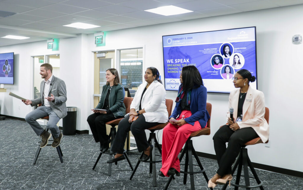 Panel of 4 women being asked questions by a male moderator